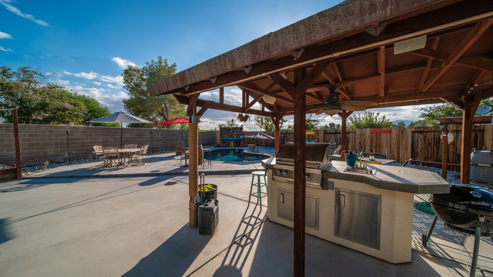 A timber pergola over an outdoor patio.